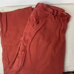 Free People cropped cargo denim with raw edge size 8 in rust.